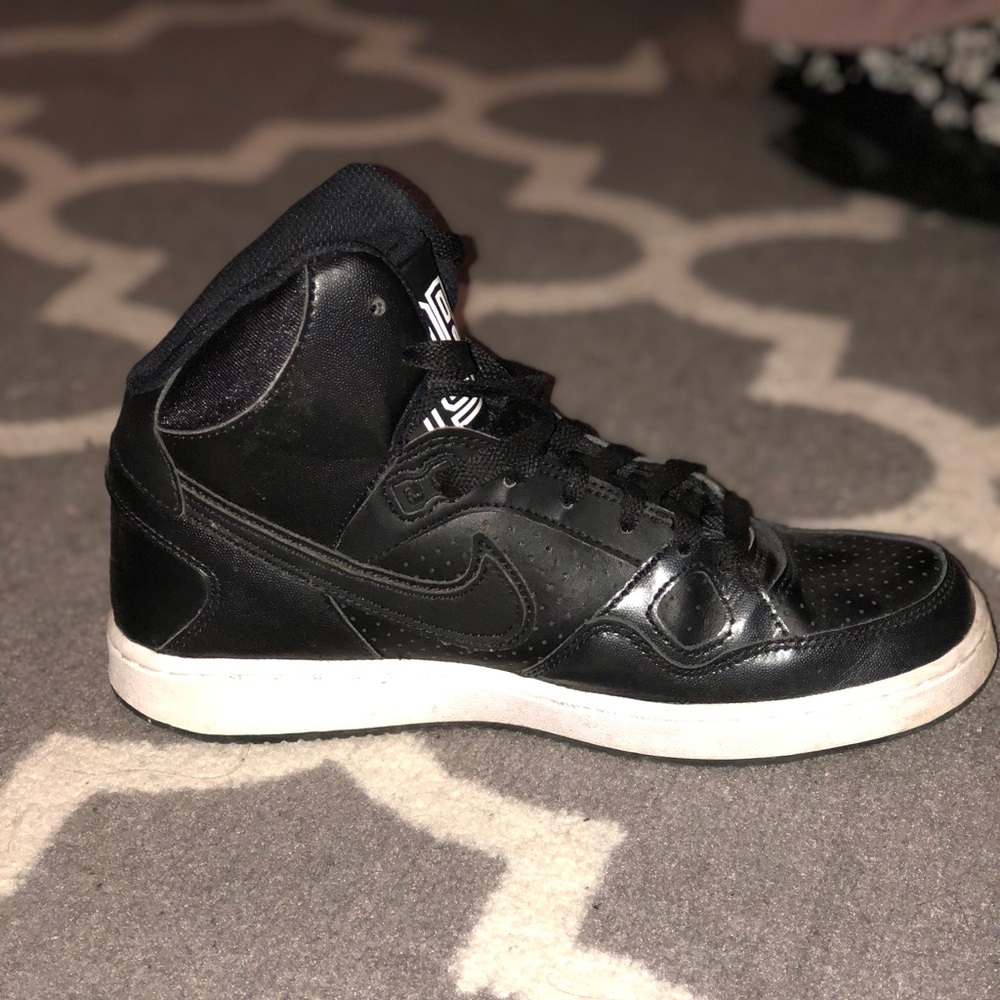 Black high-top Nike’s
